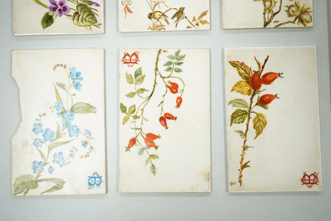 Set of seven late 19th century miniature floral painted pottery plaques, each monogramed 8.5cm high, possibly for place settings